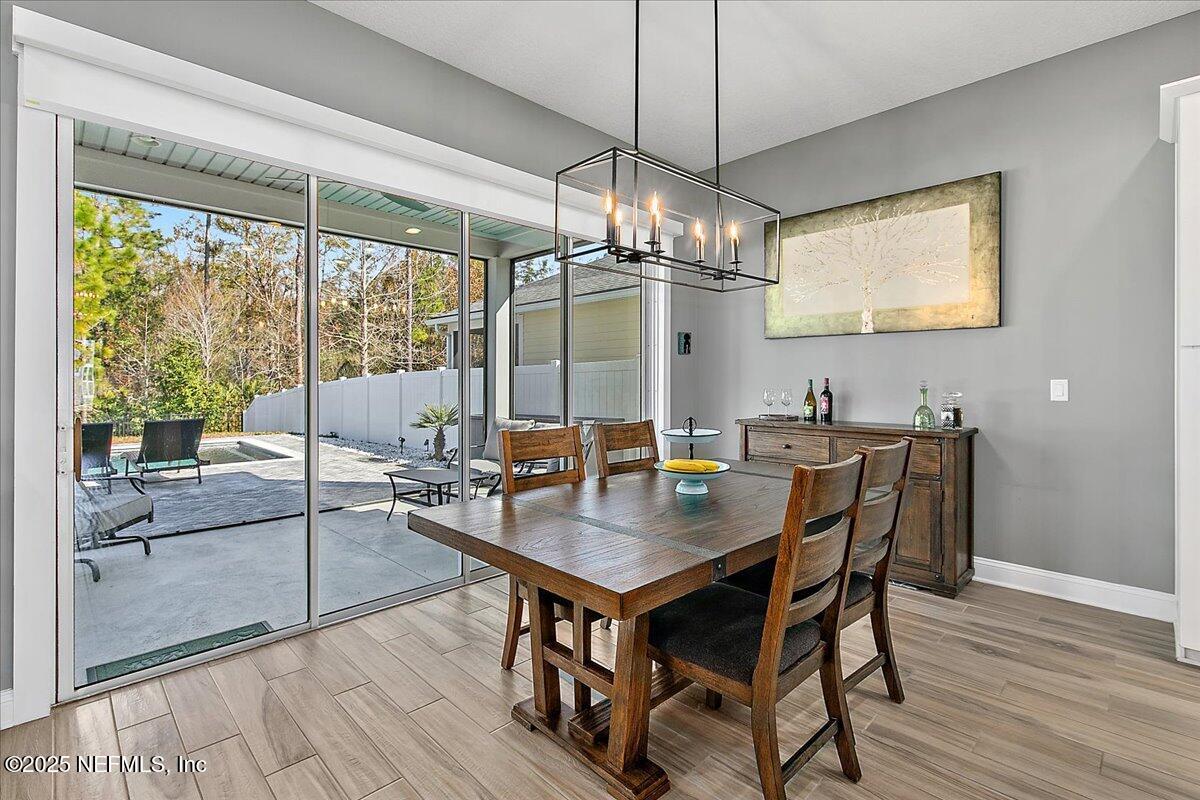78 Calumet Drive St. Johns, FL 32259 - Photo 11 of 72 a view of a dining room with furniture window and wooden floor