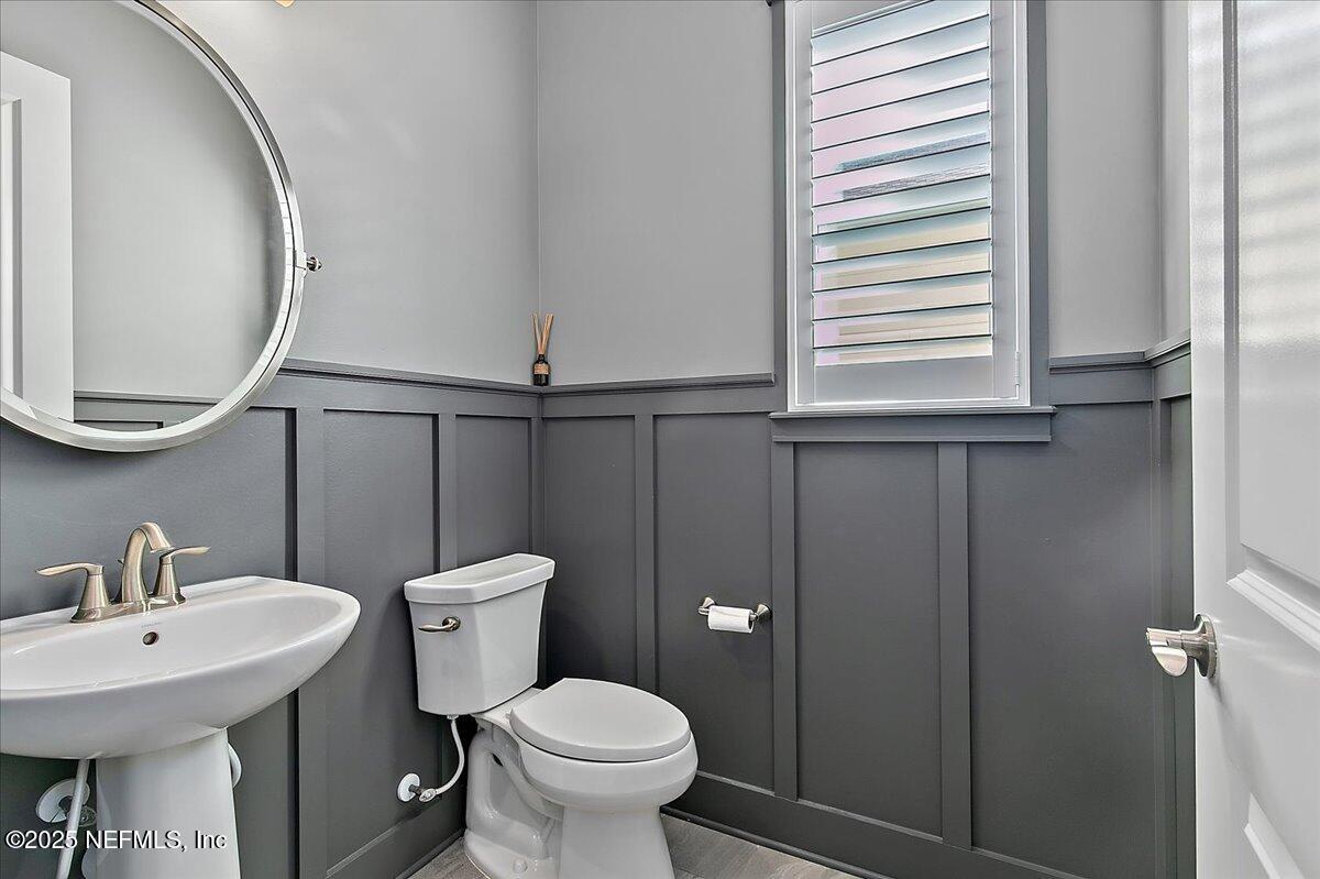 78 Calumet Drive St. Johns, FL 32259 - Photo 17 of 72 a bathroom with a toilet a sink and a mirror