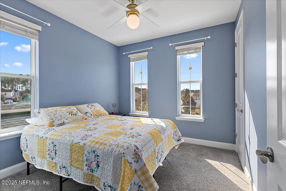 78 Calumet Drive St. Johns, FL 32259 - Photo 24 of 72 a bedroom with a bed and a window