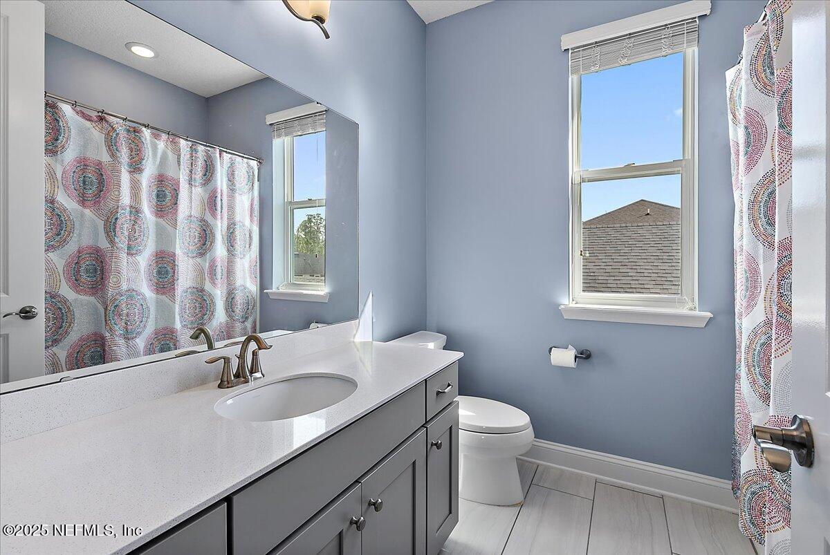 78 Calumet Drive St. Johns, FL 32259 - Photo 26 of 72 a bathroom with a granite countertop sink toilet and shower