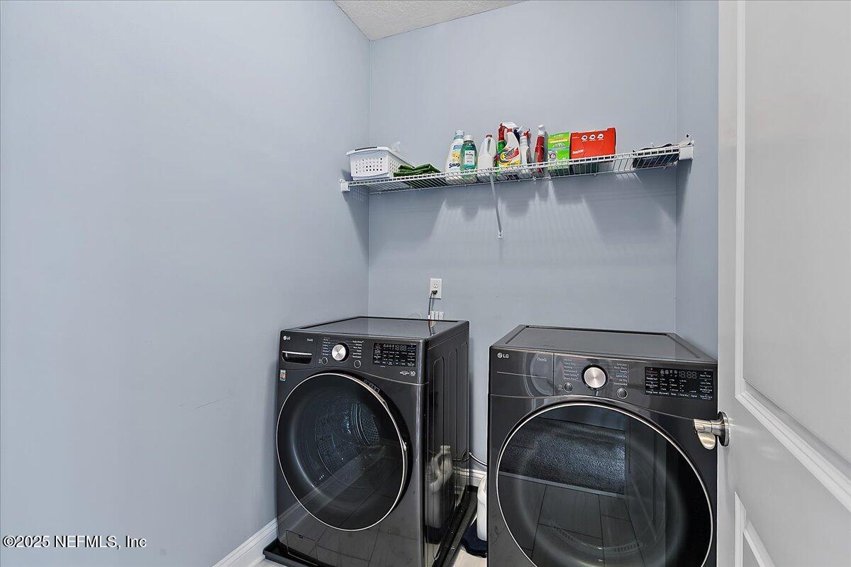 78 Calumet Drive St. Johns, FL 32259 - Photo 27 of 72 a utility room with dryer and washer