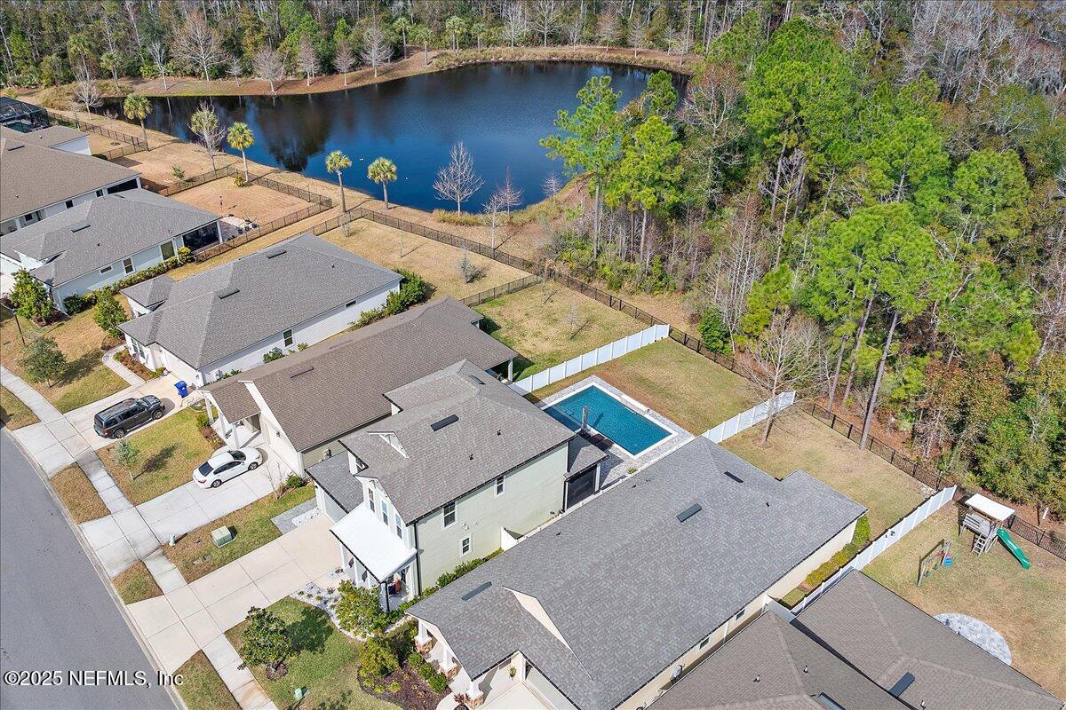 78 Calumet Drive St. Johns, FL 32259 - Photo 36 of 72 an aerial view of a house with a garden and lake view