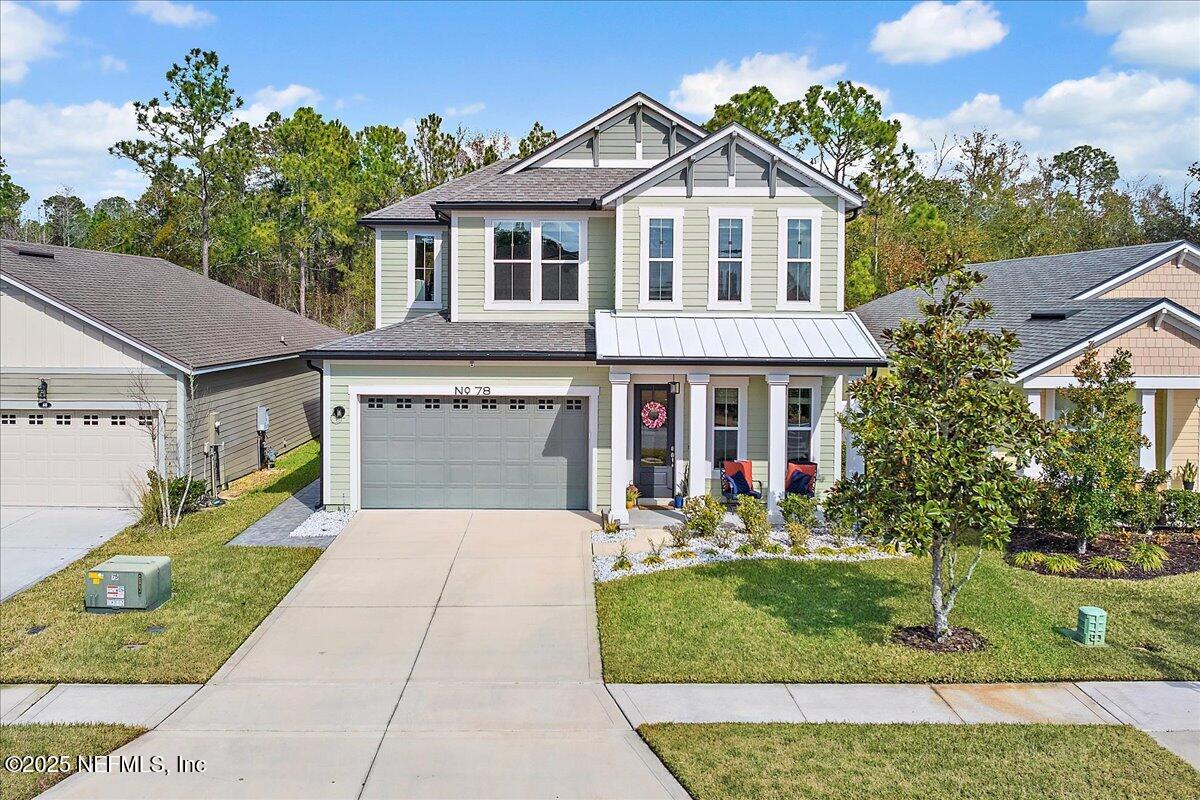 78 Calumet Drive St. Johns, FL 32259 - Photo 38 of 72 a front view of a house with garden