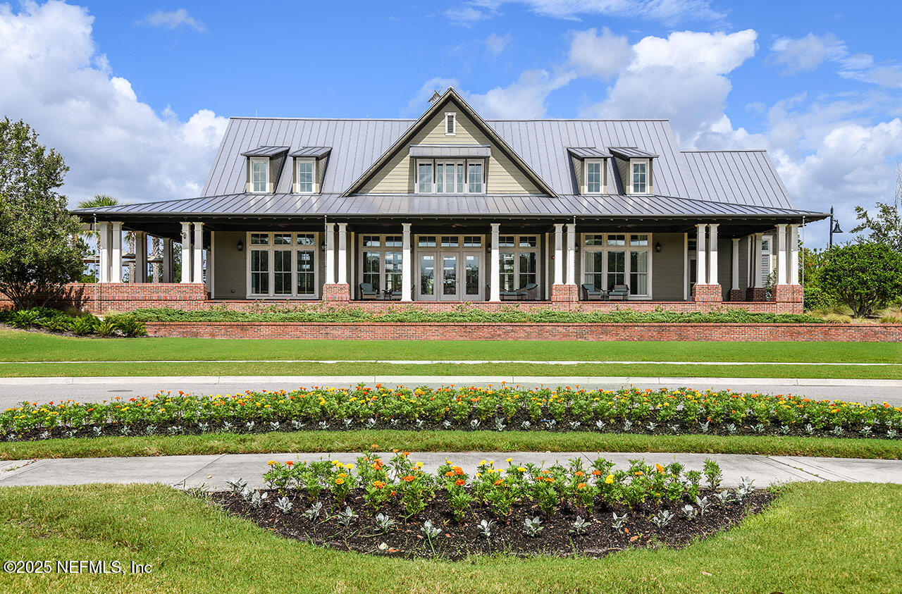 78 Calumet Drive St. Johns, FL 32259 - Photo 40 of 72 a front view of a house with a yard table and chairs