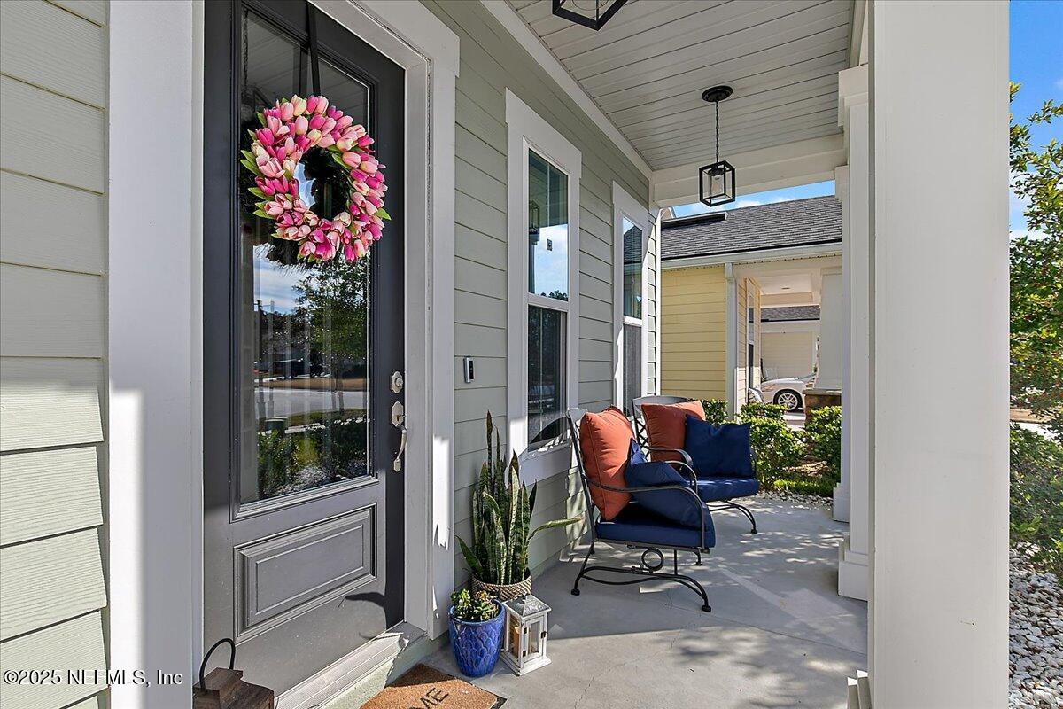 78 Calumet Drive St. Johns, FL 32259 - Photo 5 of 72 a view of a porch with chairs and potted plants