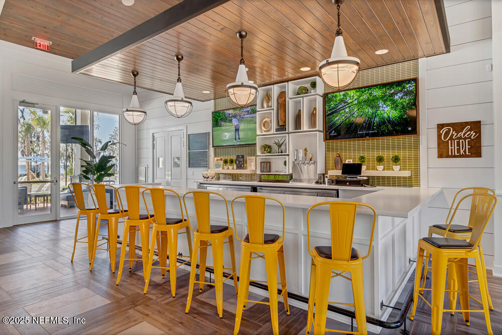78 Calumet Drive St. Johns, FL 32259 - Photo 58 of 72 a view of a dining room with furniture a chandelier and wooden floor