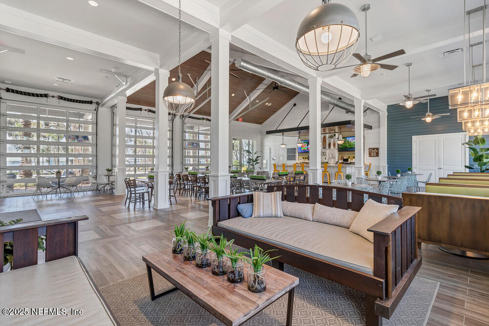 78 Calumet Drive St. Johns, FL 32259 - Photo 60 of 72 a living room with furniture a fireplace and a chandelier