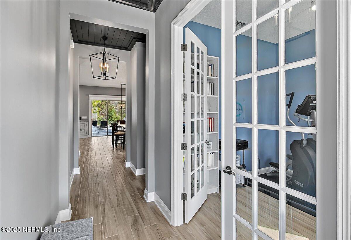 78 Calumet Drive St. Johns, FL 32259 - Photo 6 of 72 a view of a hallway with wooden floor and windows