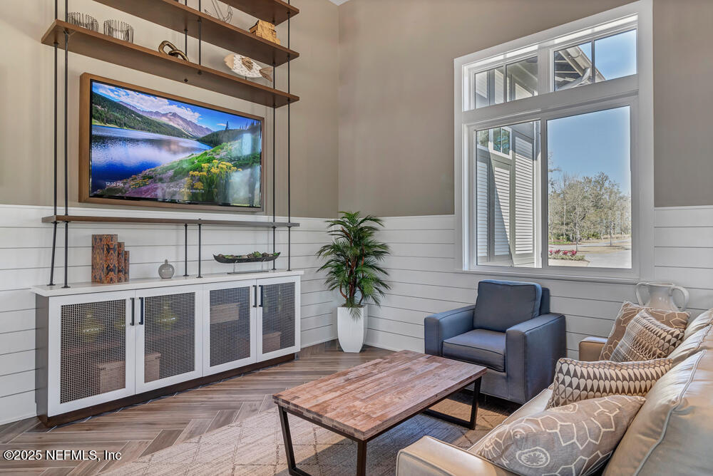 78 Calumet Drive St. Johns, FL 32259 - Photo 61 of 72 a living room with furniture a flat screen tv and a fireplace