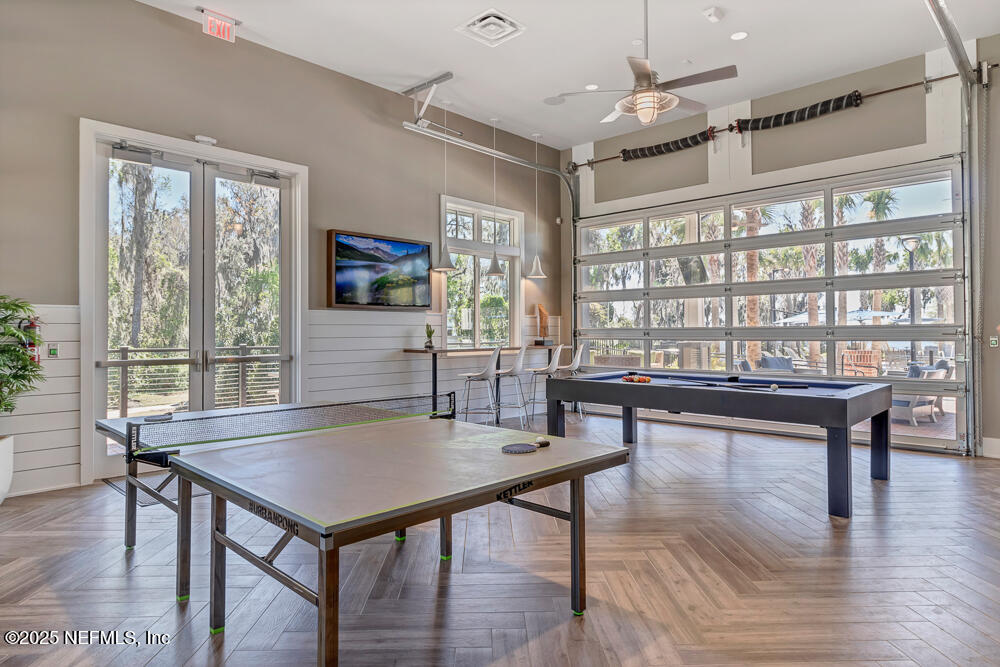 78 Calumet Drive St. Johns, FL 32259 - Photo 62 of 72 a living room with furniture a rug potted plant and a large window