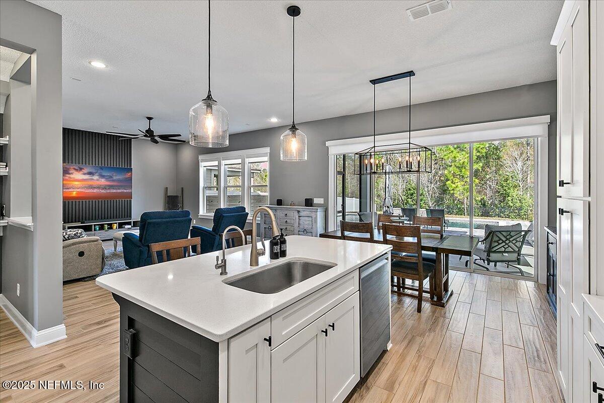 78 Calumet Drive St. Johns, FL 32259 - Photo 10 of 72 a kitchen with counter top space a sink appliances and living room view