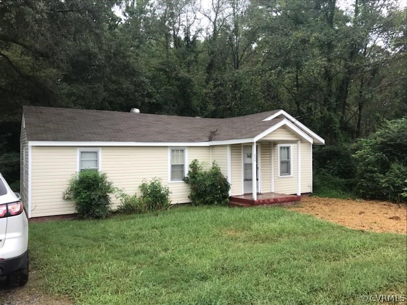 606 Cedar Level Road Hopewell, VA 23860 - Photo 1 of 7 a front view of a house with a yard and trees