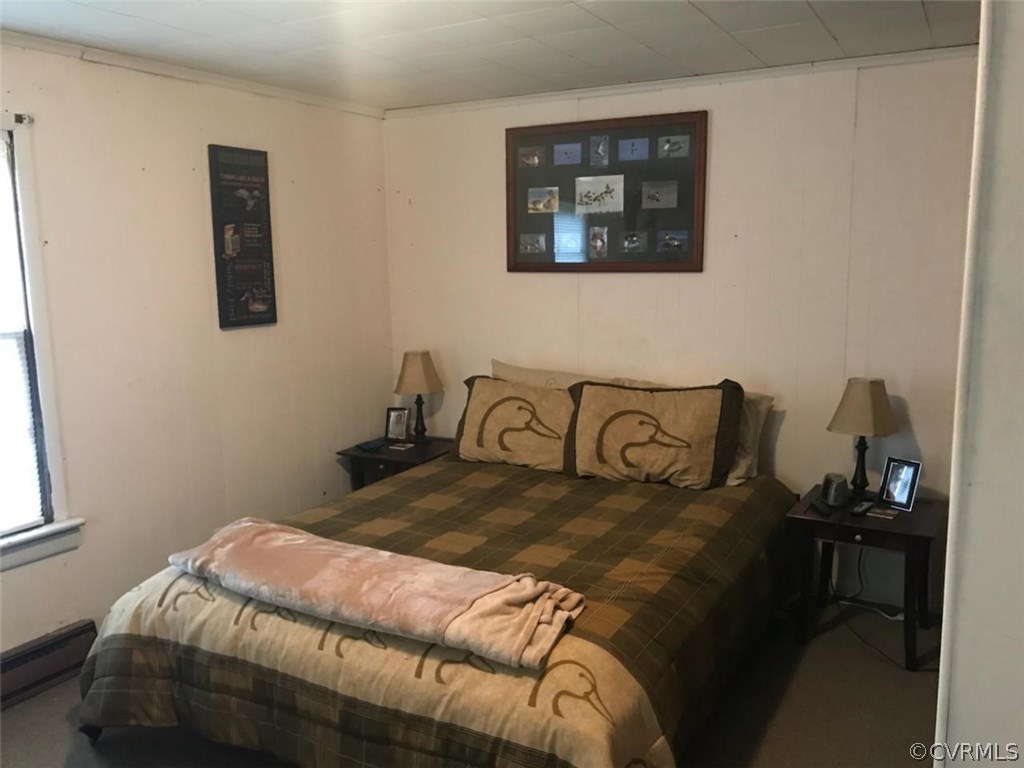 606 Cedar Level Road Hopewell, VA 23860 - Photo 4 of 7 a bedroom with a bed and a window