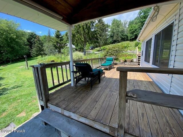 93 Miller Road Beach Lake, PA 18405 - Photo 38 of 53 a view of a two chairs in the deck