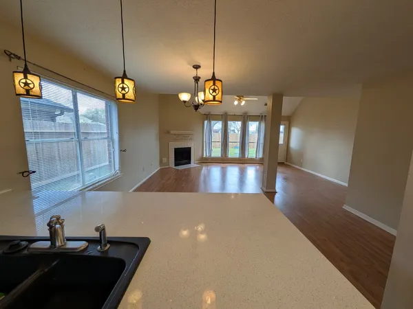 a view of a kitchen from the hallway