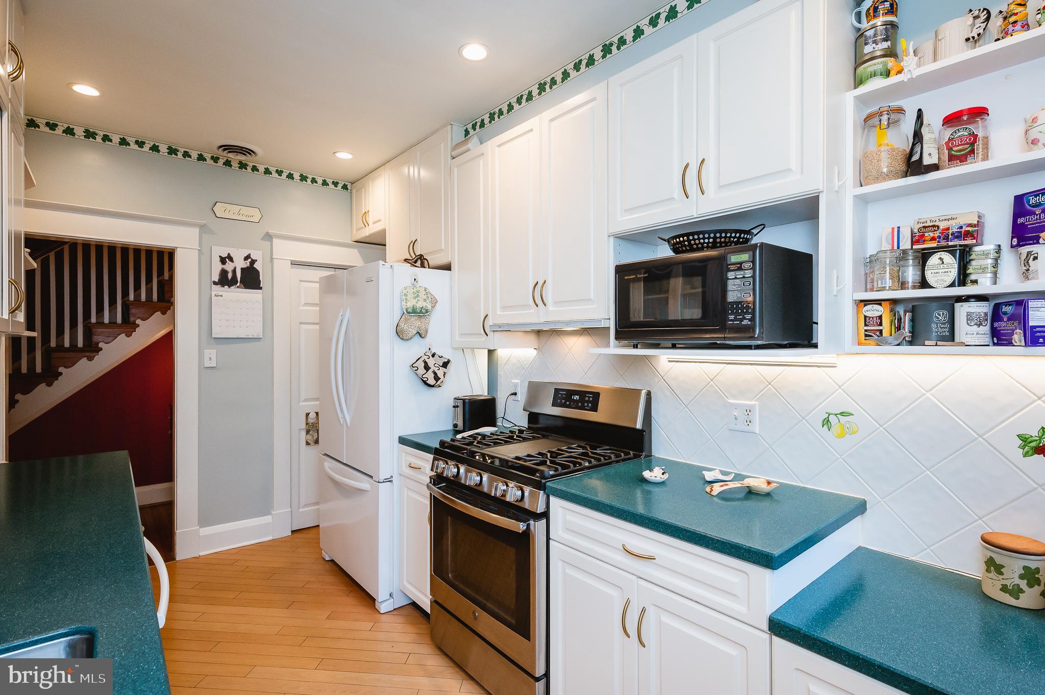 4409 Wickford Road Baltimore, MD 21210 - Photo 21 of 58 SS gas stove & open shelving