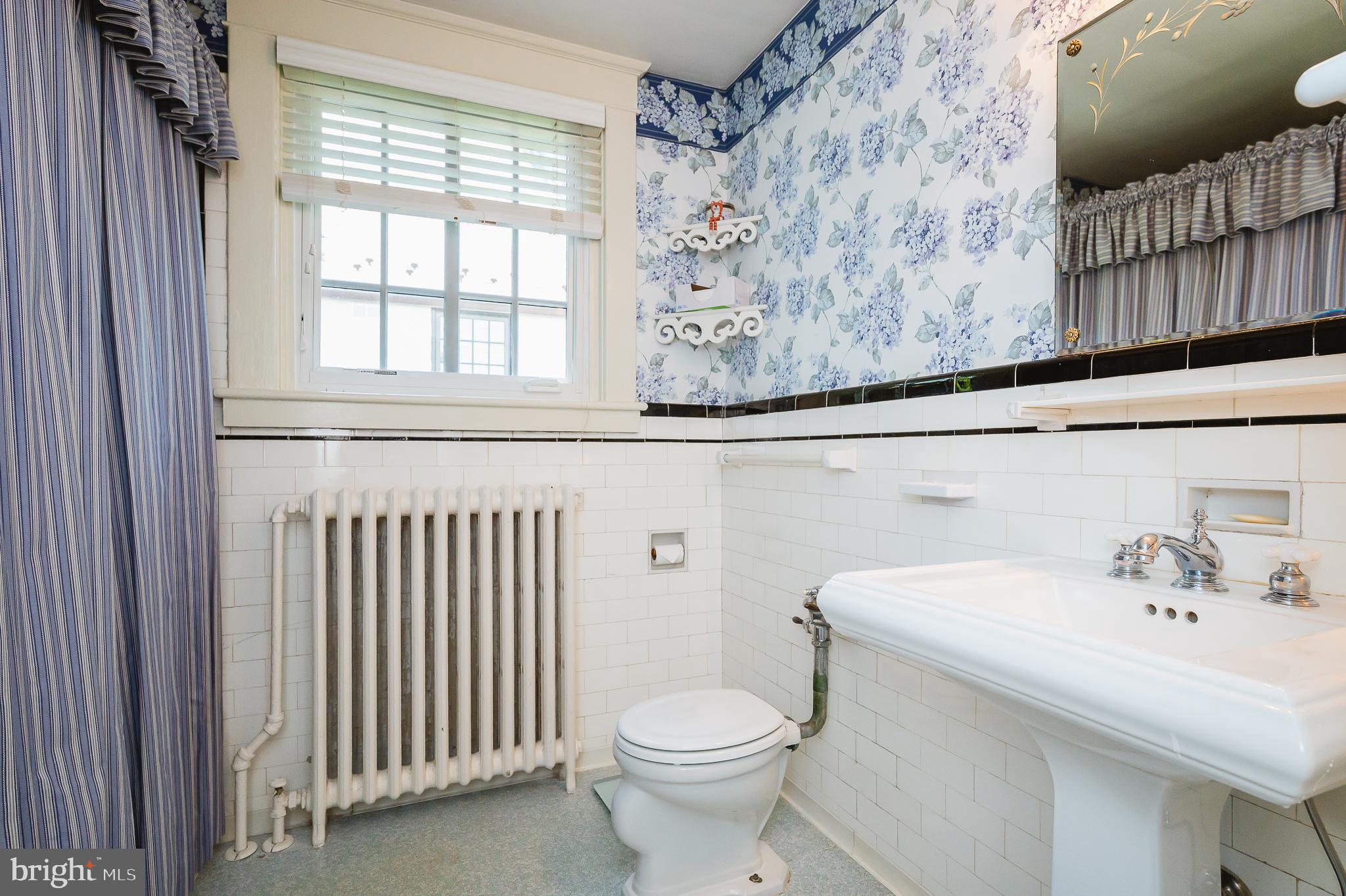 4409 Wickford Road Baltimore, MD 21210 - Photo 43 of 58 Hall bath with pedestal sink and tub/shower