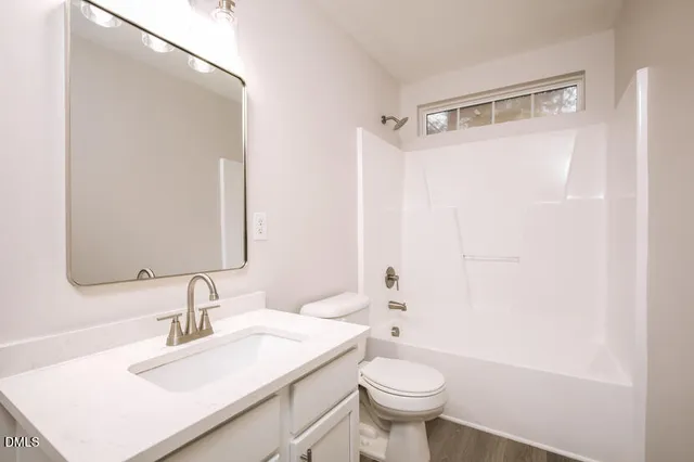 a view of cabinets and wooden floor