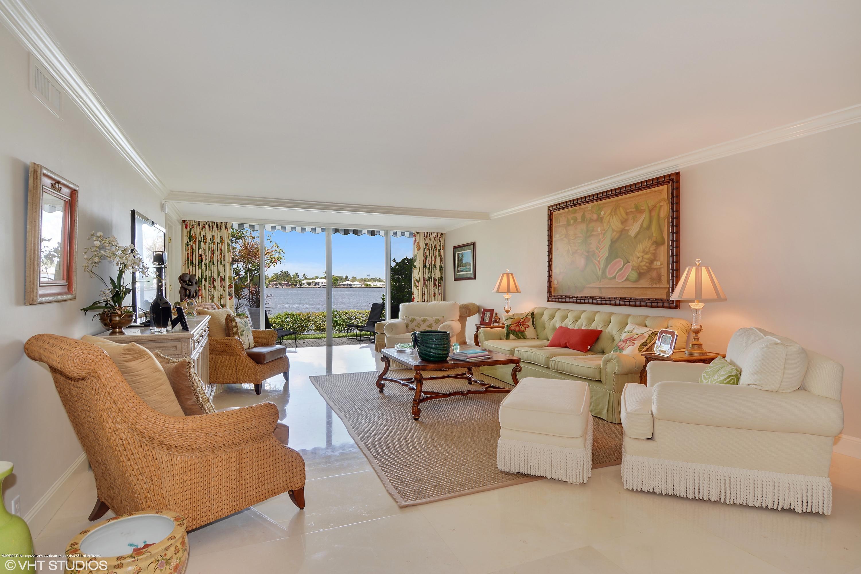 2190 Ibis Isle Road, Unit 1 Palm Beach, FL 33480 - Photo 1 of 8 a living room with furniture and a large window
