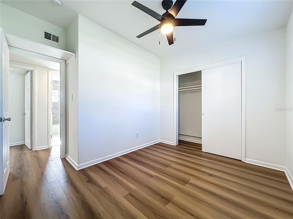 2001 Conway Gardens Road Orlando, FL 32812 - Photo 5 of 11 a view of an empty room with wooden floor