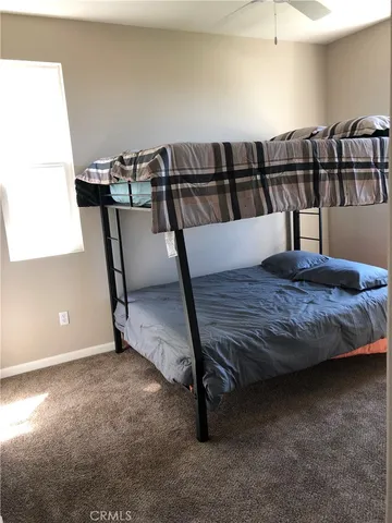 a view of a hardwood floor and staircase