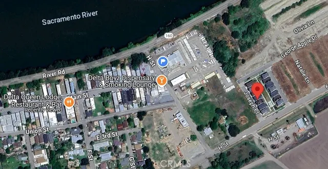 a backyard of a house with a yard and outdoor seating