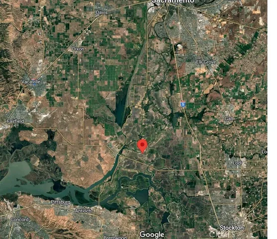 a view of a street with tall buildings