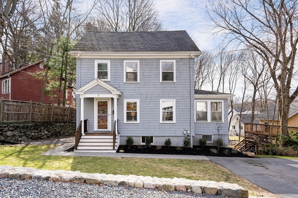57 Edmund Road Arlington, MA 02474 - Photo 1 of 36 a front view of a house with a yard