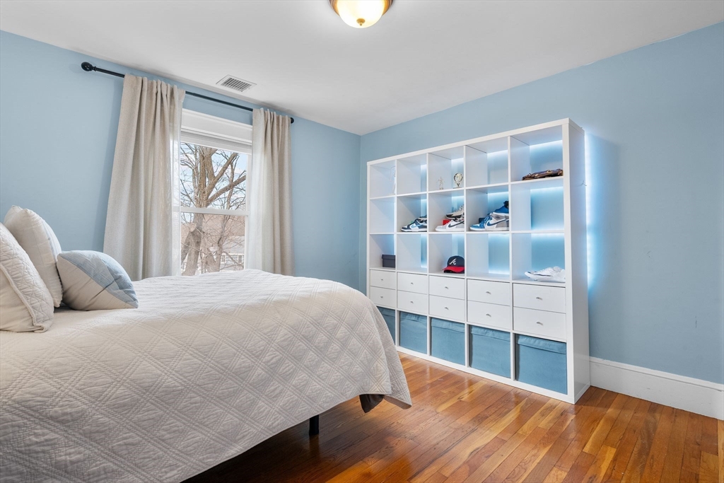57 Edmund Road Arlington, MA 02474 - Photo 23 of 36 a bedroom with a bed and a window