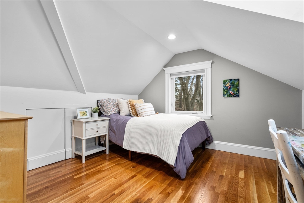57 Edmund Road Arlington, MA 02474 - Photo 29 of 36 a bedroom with a bed and a window