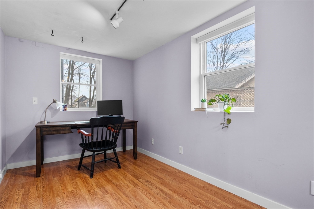 57 Edmund Road Arlington, MA 02474 - Photo 32 of 36 a workspace room with furniture and wooden floor