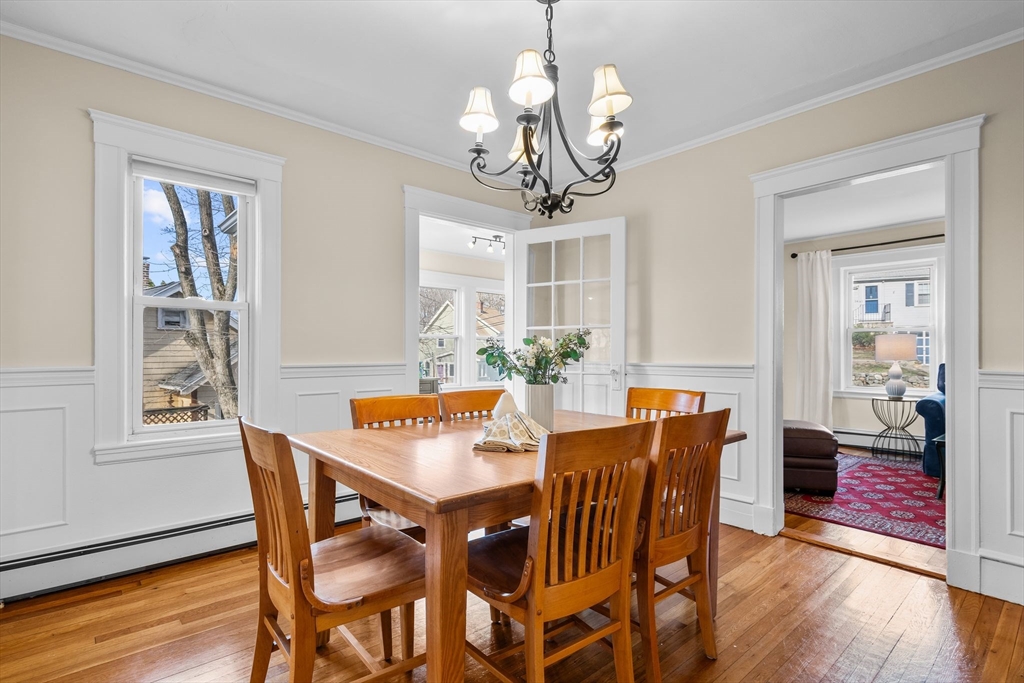 57 Edmund Road Arlington, MA 02474 - Photo 7 of 36 a view of a dining room with furniture wooden floor and chandelier