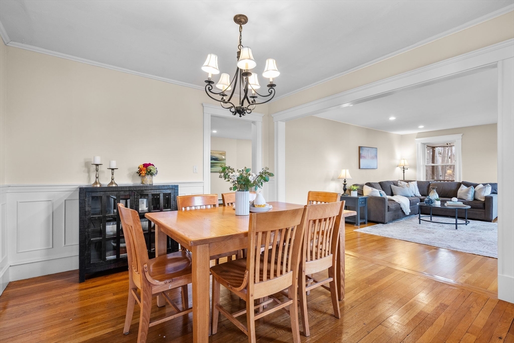 57 Edmund Road Arlington, MA 02474 - Photo 8 of 36 a view of a dining room with furniture wooden floor and chandelier
