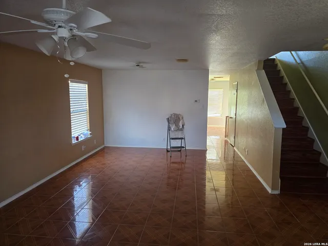 a view of livingroom with hardwood floor and ceiling fan
