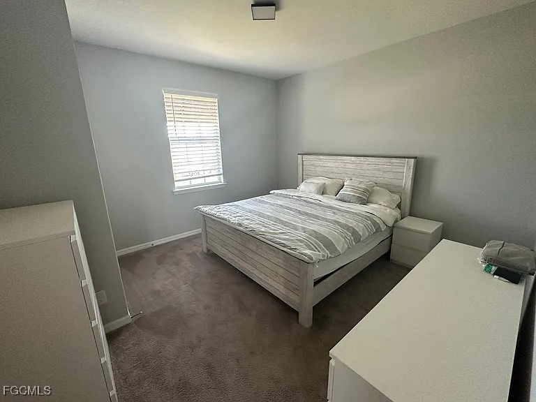 4117 Northwest 22nd Street Cape Coral, FL 33993 - Photo 12 of 31 a bedroom with a bed and window