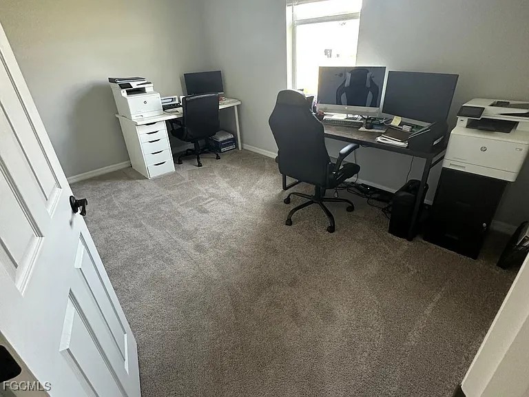 4117 Northwest 22nd Street Cape Coral, FL 33993 - Photo 20 of 31 a view of a workspace with furniture and a window