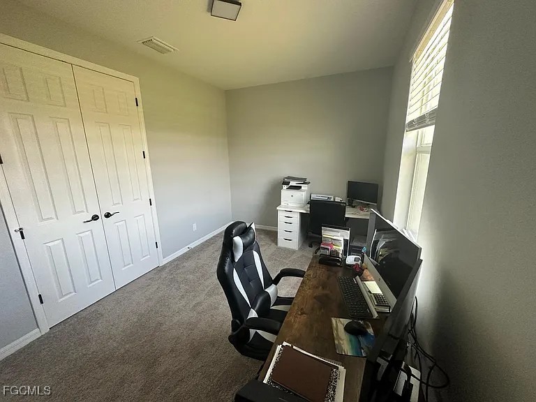 4117 Northwest 22nd Street Cape Coral, FL 33993 - Photo 21 of 31 a view of workspace with wooden floor windows
