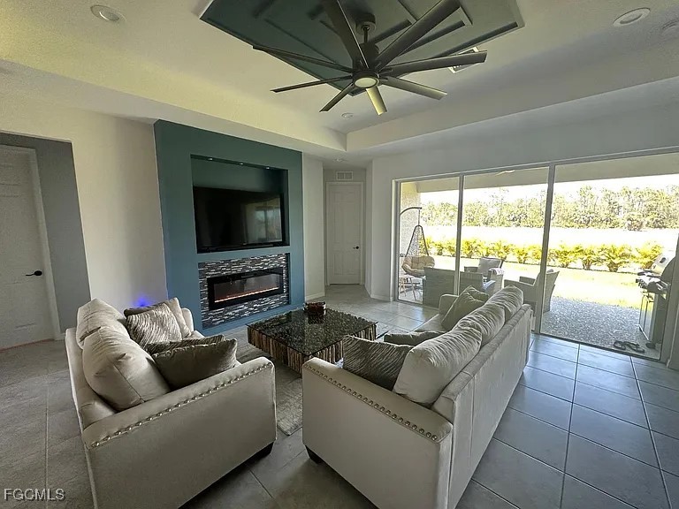 4117 Northwest 22nd Street Cape Coral, FL 33993 - Photo 5 of 31 a living room with furniture and a flat screen tv