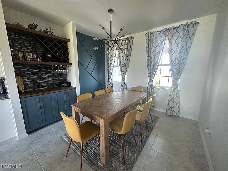 4117 Northwest 22nd Street Cape Coral, FL 33993 - Photo 6 of 31 a dining room with furniture and window