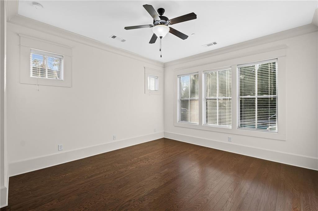 120 Walnut Circle Marietta, GA 30064 - Photo 11 of 32 a view of wooden floor and a chandelier fan in a room