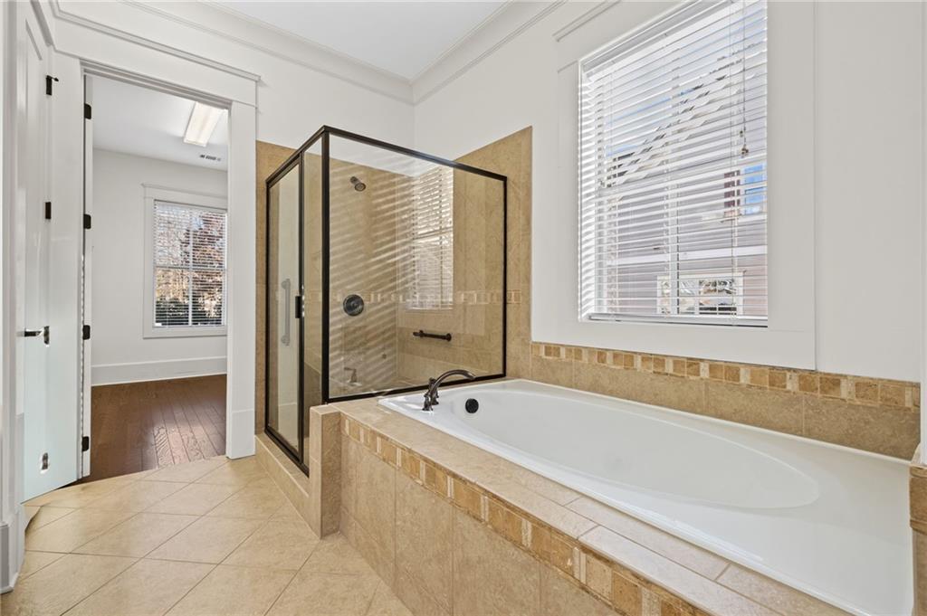 120 Walnut Circle Marietta, GA 30064 - Photo 14 of 32 a bathroom with a bathtub and a shower
