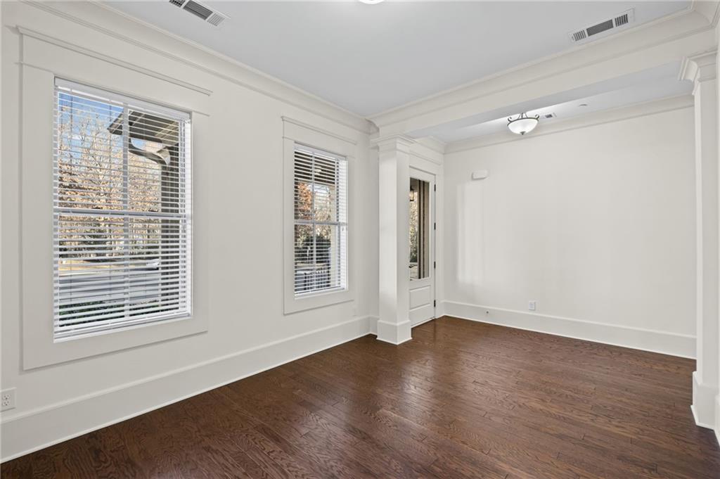 120 Walnut Circle Marietta, GA 30064 - Photo 3 of 32 a view of an empty room with wooden floor and a window