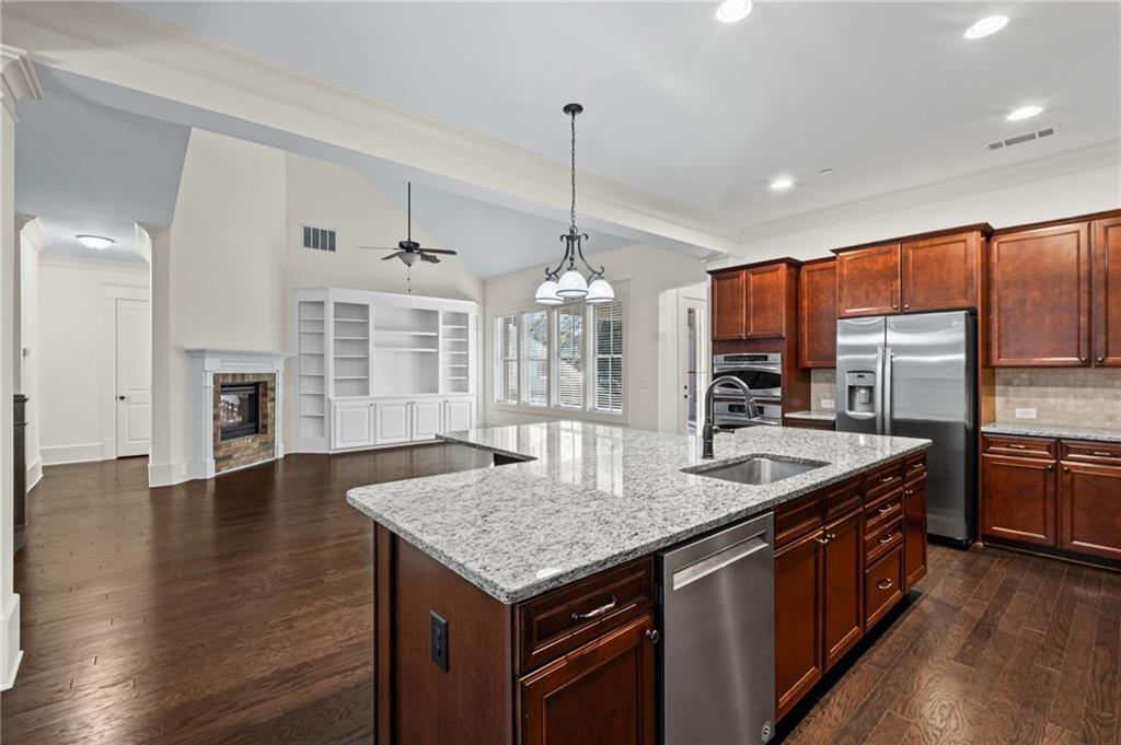 120 Walnut Circle Marietta, GA 30064 - Photo 8 of 32 a kitchen with stainless steel appliances granite countertop a kitchen island a stove and a sink