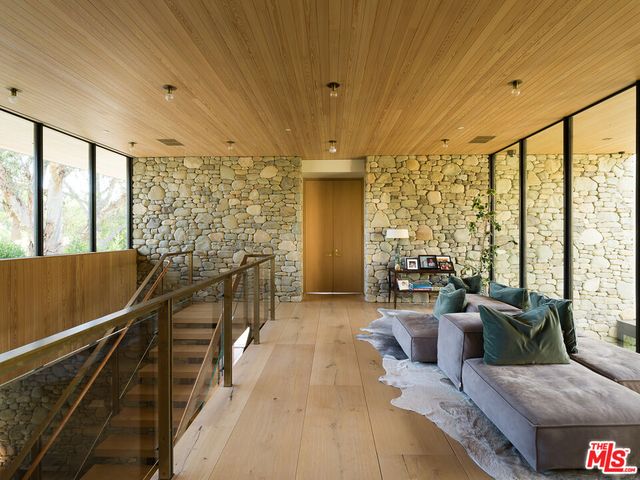 a view of a balcony with chairs