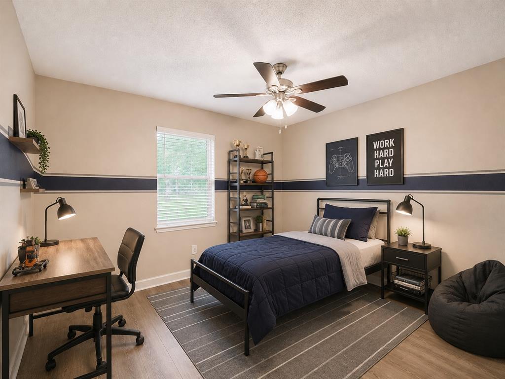 1231 Rutherford Drive Mesquite, TX 75149 - Photo 15 of 29 a bedroom with a bed and a desk