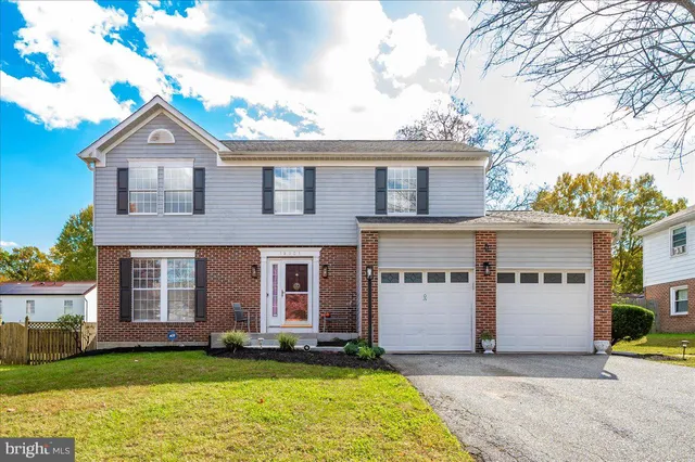 a view of a house with garden and yard