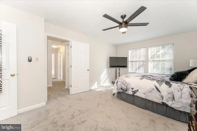 a bedroom with a bed and a television