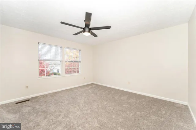 a view of a ceiling fan in a room