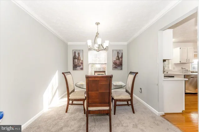 a kitchen with stainless steel appliances a refrigerator sink and microwave