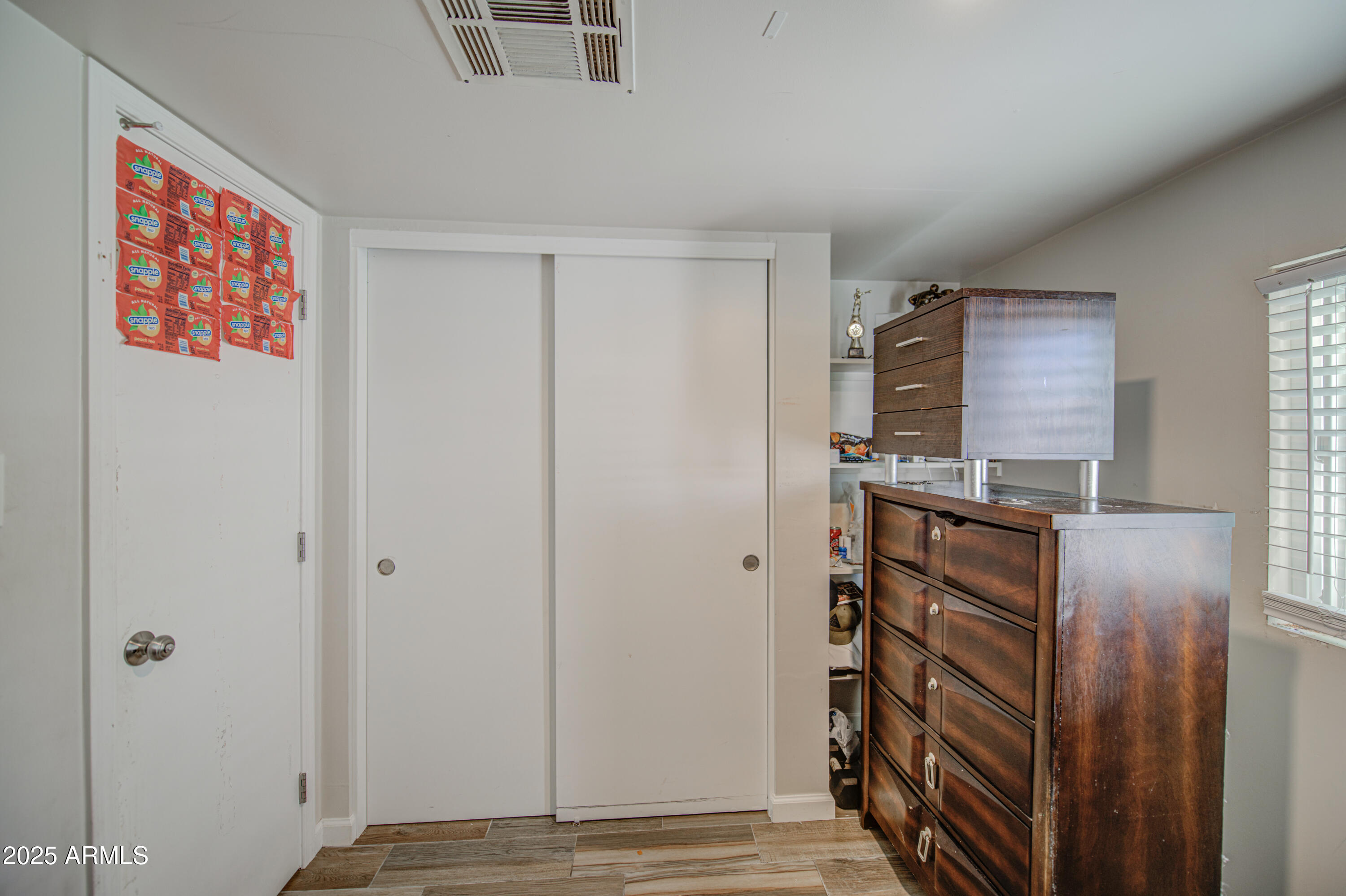 1304 East Bell Road, Unit 43 Phoenix, AZ 85022 - Photo 7 of 9 a view of an entryway with wooden floor